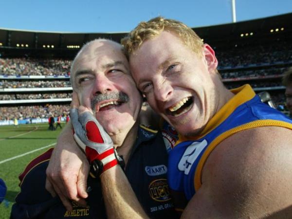 SEPTEMBER 27, 2003 : Coach Leigh Matthews (L) & captain Michael Voss celebrate following Brisbane Lions v Collingwood AFL Grand Final at MCG in Melbourne, 27/09/03. Pic David Kapernick.<em></em>
Australian Rules