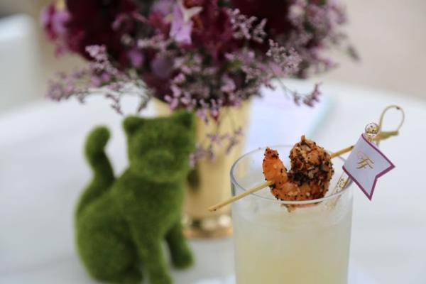 Guests were served a basil lemo<em></em>nade “Fancy Feast Style,” garnished with a shrimp coated in an everything bagel seasoning, an ode to the event’s New York City venue.