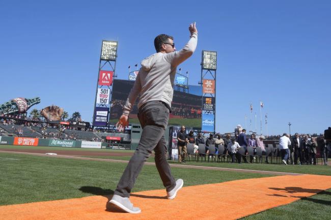 Former San Francisco Giants player Buster Posey waves before a ceremony inducting lo<em></em>ngtime Giants clubhouse manager Mike "Murph" Murphy into the team's Wall of Fame before a ba<em></em>seball game between the Giants and the Atlanta Braves in San Francisco, Sunday, Aug. 27, 2023. (AP Photo/Jeff Chiu)