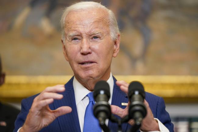 President Joe Biden, center, delivers remarks on recovery efforts for the Maui wildfires and the respo<em></em>nse to Hurricane Idalia, in the Roosevelt Room of the White House, Wednesday, Aug. 30, 2023, in Washington. (AP Photo/Evan Vucci)