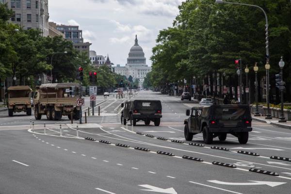 FILE - Natio<em></em>nal Guard vehicles drive along Pennsylvania Avenue NW, as they prepare for protests and demonstrations, June 19, 2020, in Washington. U.S. officials say the Pentagon is developing plans to restructure the Natio<em></em>nal Guard in Washington, D.C. The goal is to address problems highlighted by the chaotic respo<em></em>nse to the Jan. 6 riot and safety breaches during the 2020 protests over the murder of George Floyd. (AP Photo/Manuel Balce Ceneta, File)