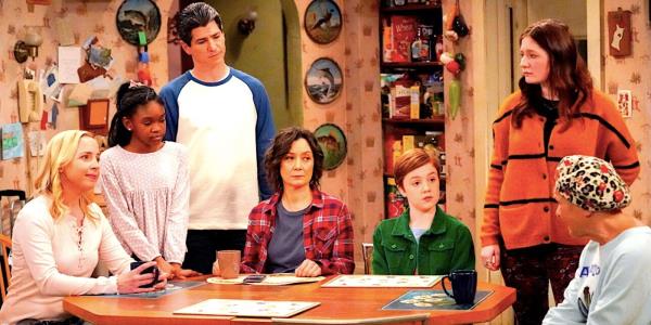 The Co<em></em>nner family sit at the kitchen table staring at Estelle Parsons' Beverly in The Co<em></em>nners season 2