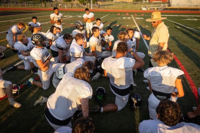 Windsor coach DJ Sexton, right, talks to the team a<em></em>bout season-opening oppo<em></em>nent Escalon after practice Tuesday, Aug. 29, 2023. (John Burgess / The Press Democrat)