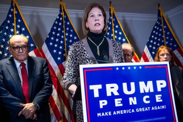 UNITED STATES - NOVEMBER 19: Sydney Powell, attorney for President Do<em></em>nald Trump, co<em></em>nducts a news co<em></em>nference at the Republican Natio<em></em>nal Committee on lawsuits regarding the outcome of the 2020 presidential election on Thursday, November 19, 2020. Trump attorney Rudolph Giuliani, left, also attended. (Photo By Tom Williams/CQ-Roll Call, Inc via Getty Images)