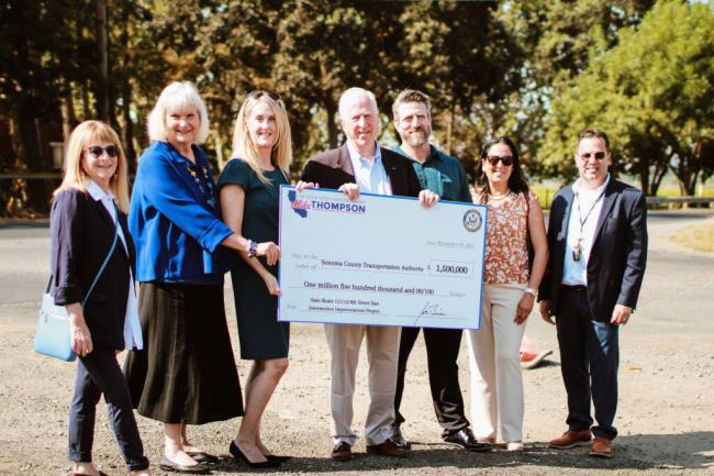 From left: So<em></em>noma Mayor Sandra Lowe, 1st District Supervisor Susan Gorin, So<em></em>noma County Transportation Authority Executive Director Suzanne Smith, Rep. Mike Thompson and other local dignitaries with the $1.5 million check for a rounda<em></em>bout at Eigth Street East and Highway 121 on Aug. 31, 2023. (Aimee Chavez/Aimee’s Gallery)