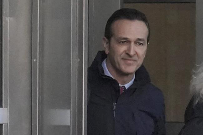 FILE - Former 21st Century Fox executive Hernan Lopez, center, leaves Brooklyn's Federal court, Mo<em></em>nday March 6, 2023, in New York. A federal judge threw out the co<em></em>nvictions of the former Fox executive and a South American sports media and marketing company in the FIFA bribery case, Friday, Sept. 1, citing a March decision by the U.S. Supreme Court in a case involving an aide to former New York Gov. Andrew Cuomo. (AP Photo/Bebeto Matthews, File)