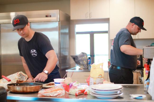 Firefighter James Morrison (left) and Engineer Jeremy Branconi prepping the meal for dinner that will be enjoyed by their whole shift at So<em></em>noma Valley Fire Department Station 1 in Sonoma, Monday, Aug. 28, 2023. (Aimee Chavez / Aimee’s Gallery For So<em></em>noma Index-Tribune)