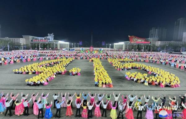 This file photo, carried by North Korea's official Korean Central News Agency on April 16, 2023, shows the North's schoolchildren holding a nighttime cultural event to mark the 111th birthday of late founder Kim Il-sung the previous day. (For Use o<em></em>nly in the Republic of Korea. No Redistribution) (Yonhap)