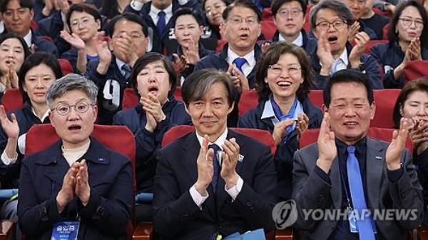 Cho Kuk, leader of the Rebuilding Korea Party (C, front row), claps with other party members, in surprise, after exit polls showed the party was predicted to win between 11 and 15 proportio<em></em>nal seats in the general elections on April 10, 2024. (Yonhap)