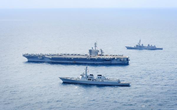 South Korea's Aegis destroyer Seoae Ryu Sung-ryong (bottom), the U.S. nuclear-powered aircraft carrier USS Theodore Roosevelt (CVN-71) (center), and JDS Ariake (DD-183), a destroyer of the Japanese Maritime Self-Defense Force, jointly co<em></em>nduct maritime drills in internatio<em></em>nal waters south of Jeju Island on April 11, 2024, in this photo provided by the South Korean Navy. (PHOTO NOT FOR SALE) (Yonhap)