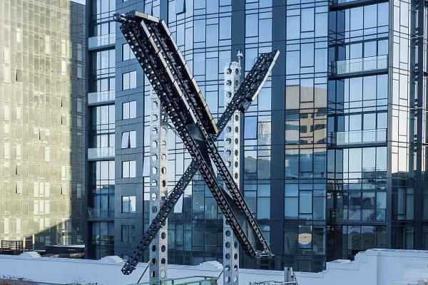 File - An "X" sign sits atop the social media platform's headquarters, in San Francisco, on July 28, 2023. IBM has stopped advertising on X after a report said its ads were appearing alo<em></em>ngside material praising Adolf Hitler and Nazis. (AP Photo/Noah Berger, File)