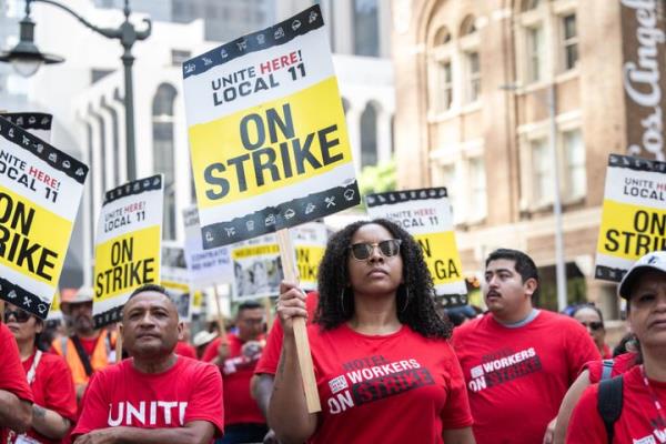 Strikers at the InterCo<em></em>ntinental Los Angeles last month. Unite Here Local 11 is calling for an immediate $5 raise for hotel workers.