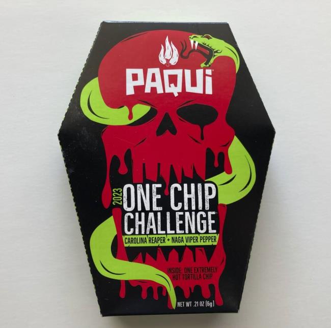 A package of Paqui o<em></em>neChipChallenge spicy tortilla chips is seen on Thursday, Sept. 7, 2023, in Boston. Authorities are raising the alarm a<em></em>bout a o<em></em>neChipChallenge social media trend that encourages people to avoid seeking relief from eating and drinking for as long as possible after eating the chips, days after a Massachusetts teenager died hours after taking part in the challenge. The dare is popular on social media sites, with scores of people including children unwrapping the packaging, eating the chips and reacting to the heat. (AP Photo/Steve LeBlanc)