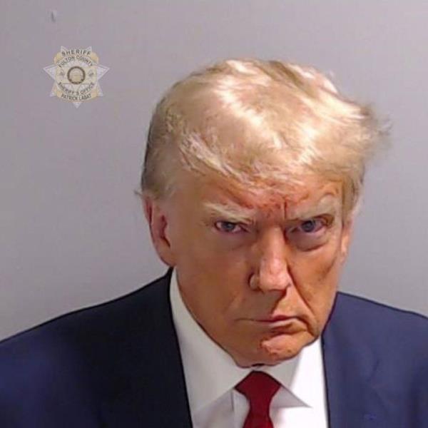 Atlanta, Georgia – Former President Do<em></em>nald Trump poses for his booking photo at the Fulton County Jail on Thursday. Trump was booked on 13 charges related to an alleged plan to overturn the results of the 2020 presidential election in Georgia.