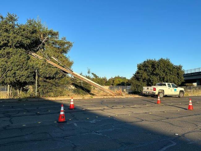A crash on Cleveland Avenue in Santa Rosa downed power lines and prom<em></em>pted a partial closure of the street, Friday, Sept. 8, 2023. (Colin Atagi / The Press Democrat)
