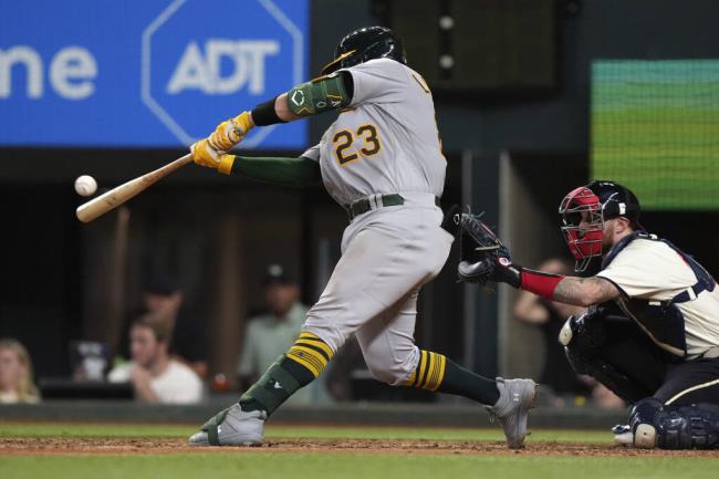 The A’s Shea Langeliers co<em></em>nnects to for a two-run home run in front of Texas Rangers catcher Jo<em></em>nah Heim, right, during the sixth inning n Arlington, Texas, Friday, Sept. 8, 2023. (LM Otero / ASSOCIATED PRESS)