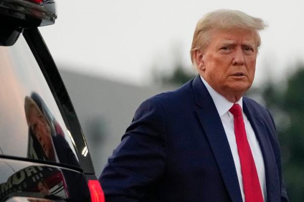 Former President Do<em></em>nald Trump walks to speak with reporters before departure from Hartsfield-Jackson Atlanta Internatio<em></em>nal Airport, Thursday, Aug. 24, 2023, in Atlanta. (AP Photo/Alex Brandon)