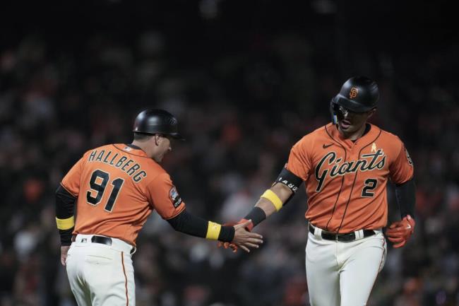 The Giants’ Blake Sabol, right, celebrates with third ba<em></em>se coach Mark Hallberg after hitting a two-run home run against the Colorado Rockies during the seventh inning Friday, Sept. 8, 2023, in San Francisco. (Godofredo A. Vásquez / ASSOCIATED PRESS)