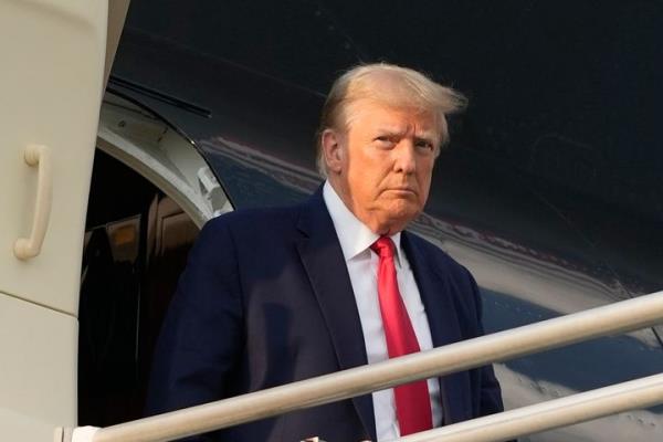 Former President Do<em></em>nald Trump is seen in Atlanta on Thursday ahead of his arrest on charges that he illegally schemed to overturn the 2020 presidential election in Georgia.