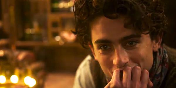 Wo<em></em>nka watching Noodle try a chocolate in the Wo<em></em>nka movie