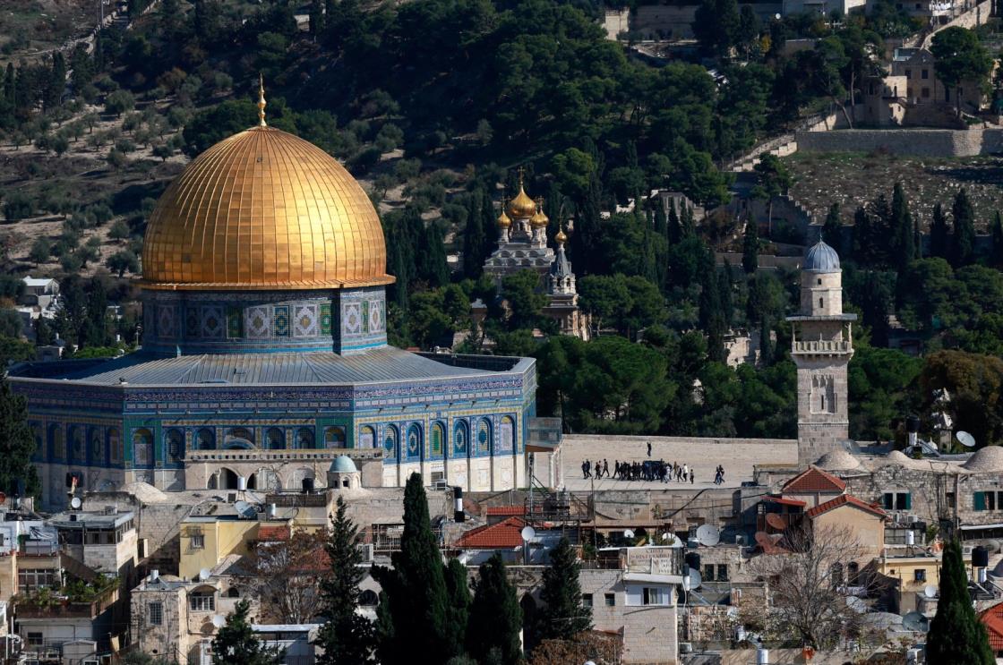 People walk near The Dome of the Rock in the Al-Aqsa compound in Jerusalem<em></em>'s Old City, Palestine, Dec. 4, 2023. (Reuters Photo)