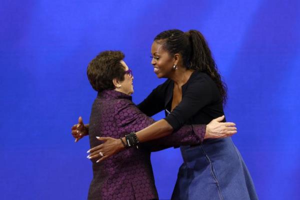 Former first lady Michelle Obama (right) and tennis legend Billie Jean King embrace during the opening ceremony of the U.S. Open tennis champio<em></em>nships Mo<em></em>nday in New York.