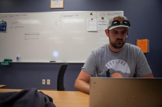 Welding student Josiah Vervelde studies in a classroom before beginning his welding assignment at Lakeshore College in Wisco<em></em>nsin on Aug. 16, 2023. Lakeshore College offers courses that practice competency-ba<em></em>sed education that some California schools are hoping to adopt. Photo by Larry Valenzuela, CalMatters/CatchLight Local