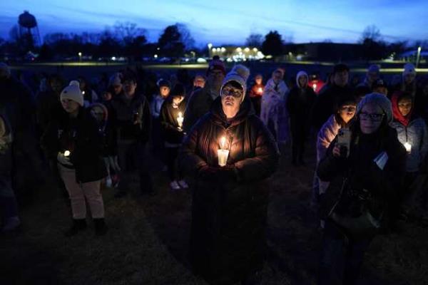 Local<em></em> residents<em></em> pray<em></em> during<em></em> a<em></em> candlelight<em></em> vigil<em></em> following<em></em> a<em></em> shooting<em></em> at<em></em> Perry<em></em> High<em></em> School,<em></em> Thursday,<em></em> Jan.<em></em> 4,<em></em> 2024,<em></em> in<em></em> Perry,<em></em> Iowa.<em></em> <em></em>(AP<em></em> Photo<em></em>/Charlie<em></em> Neibergall<em></em>)