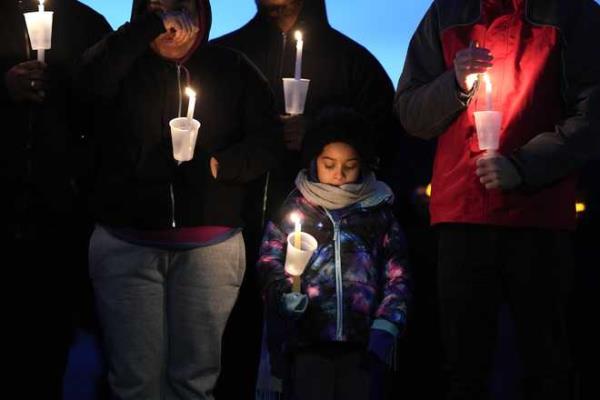 Local<em></em> residents<em></em> pray<em></em> during<em></em> a<em></em> candlelight<em></em> vigil<em></em> following<em></em> a<em></em> shooting<em></em> at<em></em> Perry<em></em> High<em></em> School,<em></em> Thursday,<em></em> Jan.<em></em> 4,<em></em> 2024,<em></em> in<em></em> Perry,<em></em> Iowa.<em></em> <em></em>(AP<em></em> Photo<em></em>/Charlie<em></em> Neibergall<em></em>)