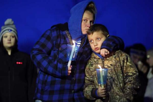 Local<em></em> residents<em></em> pray<em></em> during<em></em> a<em></em> candlelight<em></em> vigil<em></em> following<em></em> a<em></em> shooting<em></em> at<em></em> Perry<em></em> High<em></em> School,<em></em> Thursday,<em></em> Jan.<em></em> 4,<em></em> 2024,<em></em> in<em></em> Perry,<em></em> Iowa.<em></em> <em></em>(AP<em></em> Photo<em></em>/Charlie<em></em> Neibergall<em></em>)