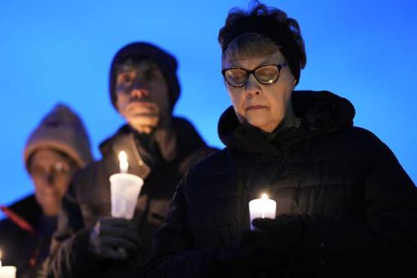 Local<em></em> residents<em></em> pray<em></em> during<em></em> a<em></em> candlelight<em></em> vigil<em></em> following<em></em> a<em></em> shooting<em></em> at<em></em> Perry<em></em> High<em></em> School,<em></em> Thursday,<em></em> Jan.<em></em> 4,<em></em> 2024,<em></em> in<em></em> Perry,<em></em> Iowa.<em></em> <em></em>(AP<em></em> Photo<em></em>/Charlie<em></em> Neibergall<em></em>)