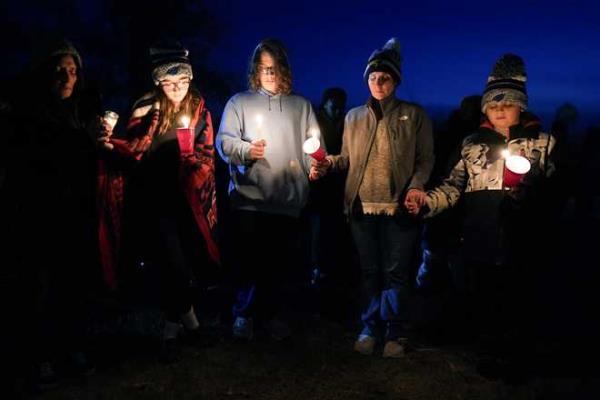 Local<em></em> residents<em></em> pray<em></em> during<em></em> a<em></em> candlelight<em></em> vigil<em></em> following<em></em> a<em></em> shooting<em></em> at<em></em> Perry<em></em> High<em></em> School,<em></em> Thursday,<em></em> Jan.<em></em> 4,<em></em> 2024,<em></em> in<em></em> Perry,<em></em> Iowa.<em></em> <em></em>(AP<em></em> Photo<em></em>/Charlie<em></em> Neibergall<em></em>)