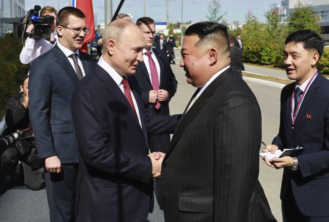 Russian President Vladimir Putin, left, and North Korea's leader Kim Jong Un shake hands during their meeting at the Vostochny cosmodrome outside the city of Tsiolkovsky, a<em></em>bout 200 kilometers (125 miles) from the city of Blagoveshchensk in the far eastern Amur region, Russia, on Wednesday, Sept. 13, 2023. (Vladimir Smirnov, Sputnik, Kremlin Pool Photo via AP)