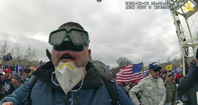 This image from police-worn body cam video co<em></em>ntained in the statement of facts to support the arrest of Joseph Padilla, shows Padilla on the West Front of the U.S. Capitol on Jan. 6, 2021, in Washington. Padilla, who wrote on social media a<em></em>bout wanting to "take over the Capitol building" before the Jan. 6, 2021 riot, where he threw a flagpole at a police officer's head, has been sentenced to more than six years in prison on Sept. 13, 2023. (Department of Justice via AP)