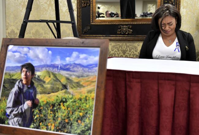 FILE - Juana Salcedo, aunt and guardian of 13-year-old Diego Stolz, cries during a news co<em></em>nference in Riverside, Calif., Oct. 29, 2019, announcing the family has started legal proceedings against the Moreno Valley Unified School District. The school district has agreed to pay $27 million to settle a lawsuit by the family of Stolz who died after being assaulted by two other students at a middle school four years ago. The settlement with the Moreno Valley Unified School District was announced Wednesday, Sept. 13, 2023, by lawyers for relatives of 13-year-old, who was was attacked at Landmark Middle School. (Will Lester/The Orange County Register via AP, File)