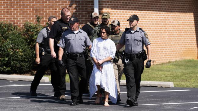 Law enforcement officers escort Danelo Cavalcante from a Pennsylvania State Police barracks in Avo<em></em>ndale Pa., on Wednesday, Sept. 13, 2023. Cavalcante was captured Wednesday after eluding hundreds of searchers for two weeks. (AP Photo/Matt Rourke)