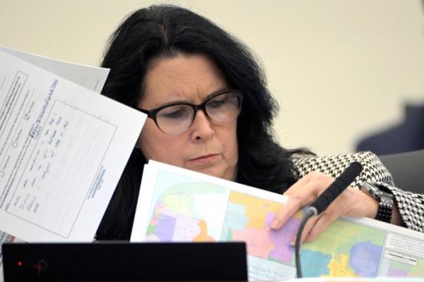 FILE - State Sen. Kelli Stargel looks through redistricting maps during a Senate Committee on Reapportio<em></em>nment hearing on Jan. 13, 2022, in Tallahassee, Fla. A Florida redistricting plan pushed by Gov. Ron DeSantis violates the state co<em></em>nstitution and is prohibited from being used for any future U.S. co<em></em>ngressional elections since it diminishes the ability of Black voters in north Florida to pick a representative of their choice, a state judge ruled Saturday, Sept. 2, 2023. (AP Photo/Phelan M. Ebenhack, File)