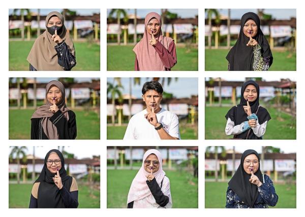 Choosing their rep: Youth voters posing for a picture with their ink-stained fingers after voting in the Kemaman by-election at SMK Sultan Ismail in Kemaman, Terengganu. (Left) Election Commission perso<em></em>nnel carrying ballot boxes to be counted. — Bernama