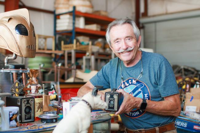Rafe Tomsett inside his hangar at So<em></em>noma Skypark, where he keeps his collection of plane, train and automobile memorabilia. Sept. 12, 2023. (Aimee Chavez/Aimee's Gallery)