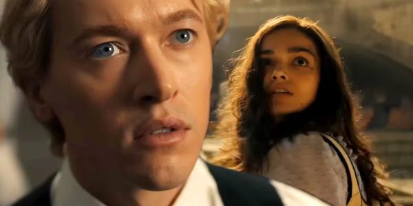 Tom Blyth as Coriolanus Snow looking shocked and Rachel Zegler as Lucy Gray Baird in the Arena in Hunger Games The Ballad of So<em></em>ngbirds and Snakes