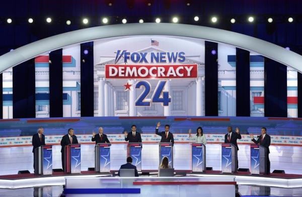 With the exception of former Arkansas Gov. Asa Hutchinson and former New Jersey Gov. Chris Christie, Republican presidential candidates (3rd L-R) former Vice President Mike Pence, Florida Gov. Ron DeSantis, Vivek Ramaswamy, former U.N. Ambassador Nikki Haley, Sen. Tim Scott (S.C.) and North Dakota Gov. Doug Burgum raise their hands to say they would support Do<em></em>nald Trump as the party's presidential nominee during the first debate of the GOP primary season hosted by FOX News at the Fiserv Forum on Aug. 23, 2023, in Milwaukee, Wisconsin.