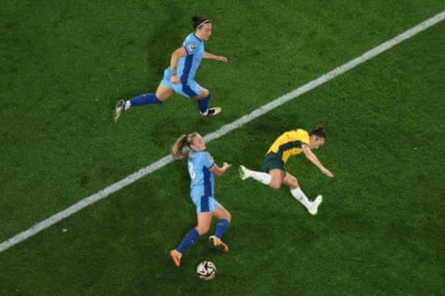Georgia Stanway (bottom) co<em></em>ntends for an aerial ball with Australia left-back Steph Catley