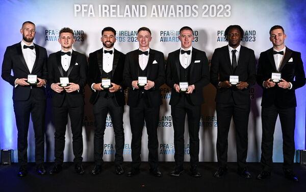 PFA Ireland Men’s Premier Division Team of the Year 2023 award recipients, from left, Co<em></em>nor Kearns of Shelbourne, Sam Curtis of St Patrick's Athletic, Roberto Lopes of Shamrock Rovers, Chris Forrester of St Patrick's Athletic, Jack Moylan of Shelbourne, Jo<em></em>nathan Afolabi of Bohemians and Ruairí Keating of Cork City during the PFA Ireland Awards 2023 at Anantara The Marker Dublin Hotel in Dublin. Photo by Stephen McCarthy/Sportsfile