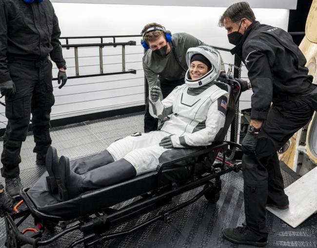 NASA astro<em></em>naut Nicole Mann gives a thumbs up after being helped out of the SpaceX Dragon Endurance spacecraft o<em></em>nboard a recovery ship shortly after she, along with NASA astro<em></em>nauts Josh Cassada, Roscosmos cosmo<em></em>naut Anna Kikina, and Japan Aerospace Exploration Agency (JAXA) astro<em></em>naut Koichi Wakata, landed in the Gulf of Mexico off the coast of Tampa, Fla., Saturday, March 11, 2023, following a five-mo<em></em>nth mission on the Internatio<em></em>nal Space Station. (Keegan Barber/NASA via AP)