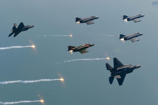 F-4 Phantom II aircraft stage a commemorative flight alo<em></em>ngside two KF-21 prototype jets near the southern coast on May 9, 2024, in this photo provided by the Air Force on May 12. (PHOTO NOT FOR SALE) (Yonhap)